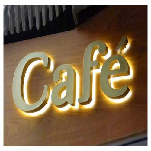 A glowing, illuminated cafe sign with 3D lettering that reads 'Café,' designed to attract attention and enhance the aesthetic appeal of a cafe's storefront.