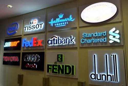 "LED signage boards of global brands including FedEx, Fendi, Citibank, and Subway displayed on a wall"
